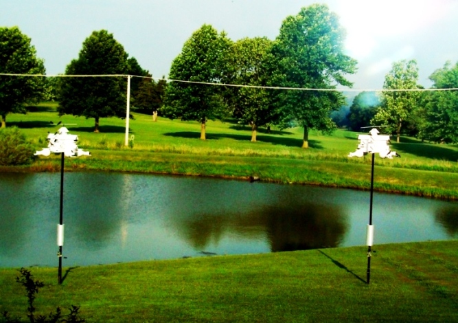 View of my two houses with pond and golf course in the background.